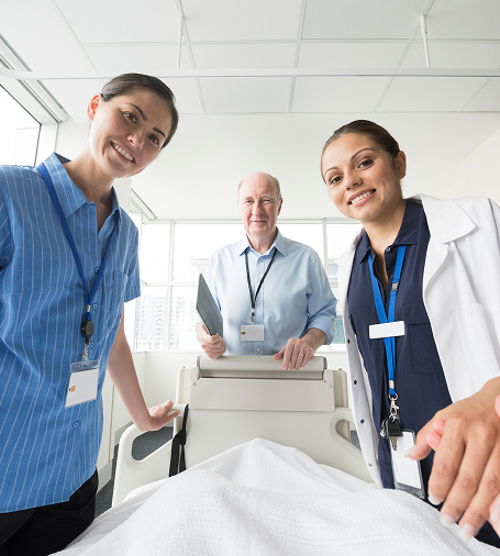 Hospital staff looking at the camera and smiling.