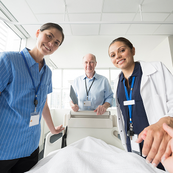 Hospital staff looking at the camera and smiling.