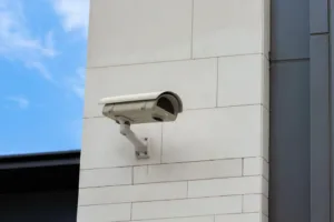 Security camera monitors the building perimeter to enhance visibility and strengthen integrated surveillance coverage.