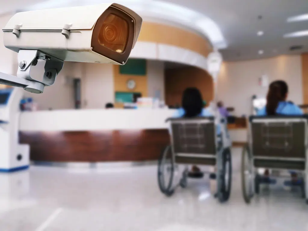 Surveillance camera oversees healthcare facility to support safety, awareness, and proactive protection for people.